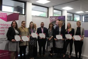 group of advisers holding their certificates 